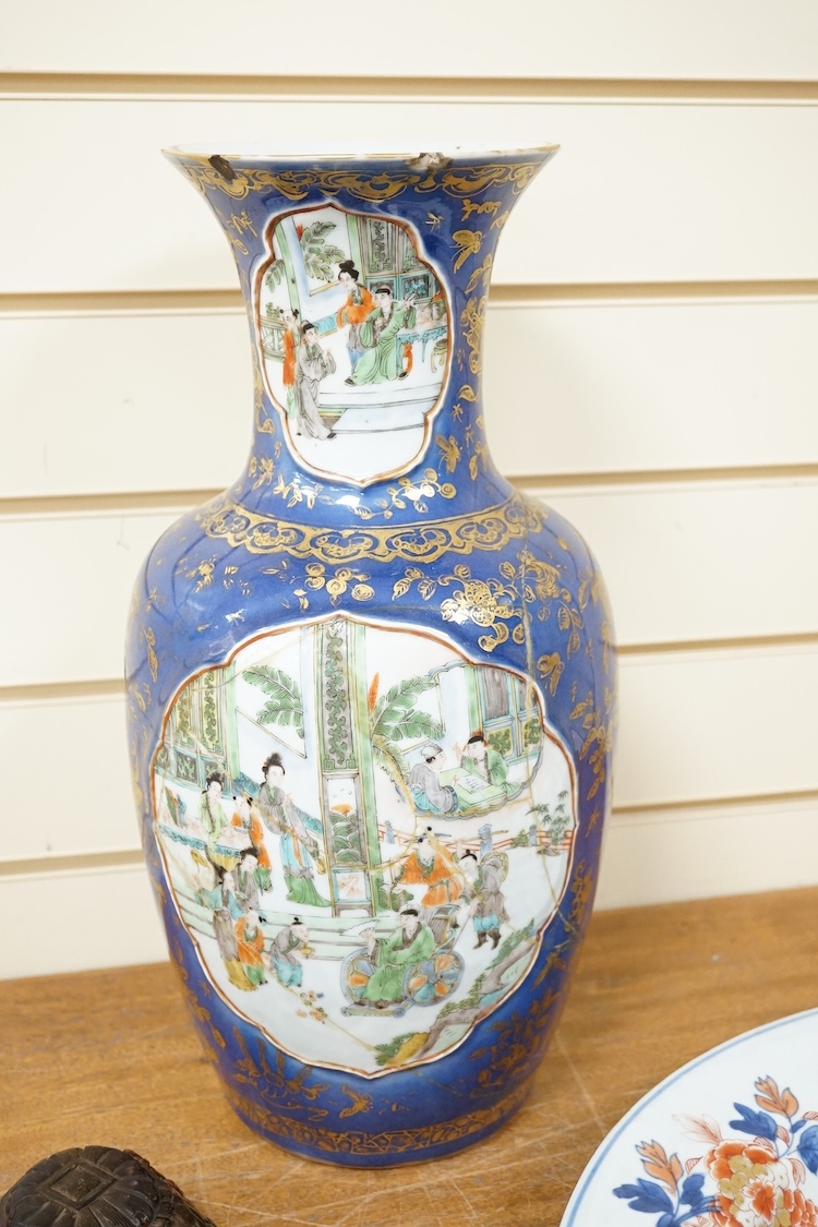Three early 18th century Chinese Imari dishes (one clobbered), largest 46.5cm, together with a 19th century Chinese powder blue ground vase, 44cm high and a horn carving, 13.7cm (5)